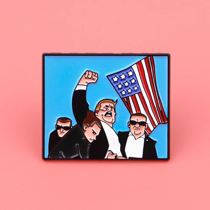 Pin’s Trump avec bras levé et drapeau usa